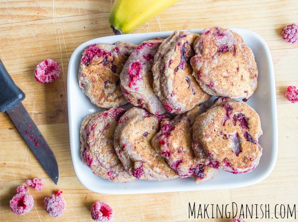 Banana and raspberry fritters on a plate