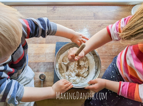 kids mixing and baking cinnamon rolls